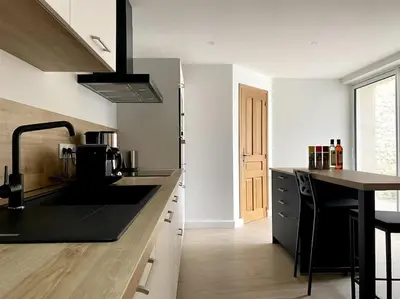 Cuisine ou kitchenette dans l'établissement BAYA HOUSE - Histoire et Confort