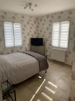Un ou plusieurs lits dans un hébergement de l'établissement Maison au sein d’un corps de ferme.