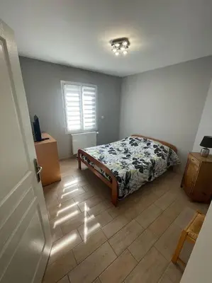 Un ou plusieurs lits dans un hébergement de l'établissement Maison au sein d’un corps de ferme.