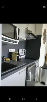 Cuisine ou kitchenette dans l'établissement Cabourg Au P'tit Nid, cocon au bord de mer