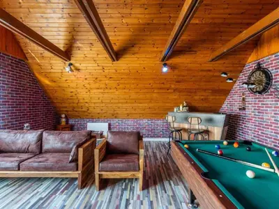 Coin salon dans l'établissement Holiday Home La Perle by Interhome