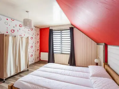 Un ou plusieurs lits dans un hébergement de l'établissement Holiday Home La Perle by Interhome