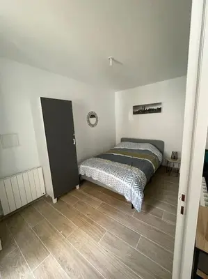 Un ou plusieurs lits dans un hébergement de l'établissement Port de Caen Appartement