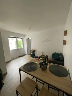 Coin salon dans l'établissement Port de Caen Appartement