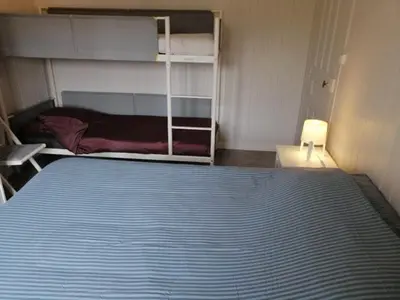 Un ou plusieurs lits dans un hébergement de l'établissement Cottage les petites voiles plage