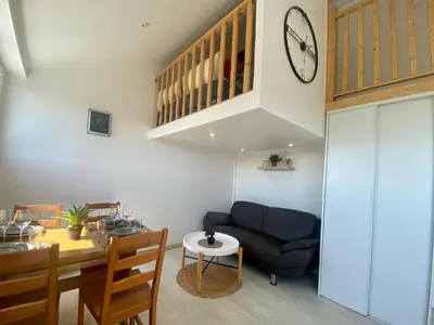Coin salon dans l'établissement Bel appartement à deux minutes de la plage