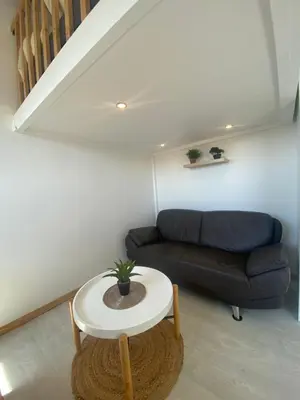 Coin salon dans l'établissement Bel appartement à deux minutes de la plage