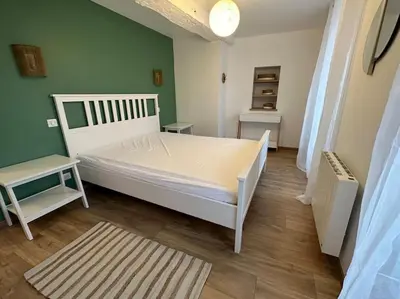 Un ou plusieurs lits dans un hébergement de l'établissement Chez Alice - Isigny le Buat