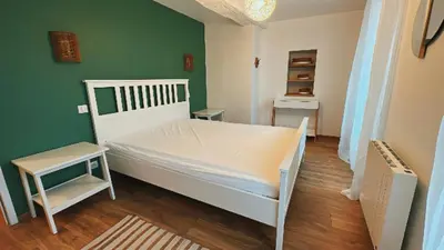 Un ou plusieurs lits dans un hébergement de l'établissement Chez Alice - Isigny le Buat