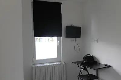Télévision ou salle de divertissement dans l'établissement Hôtel et Restaurant de la Gare Torigny-les-Villes