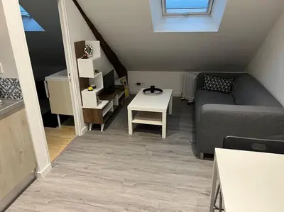 Coin salon dans l'établissement 2 Appartement neuf centre ville proche gare et commerces