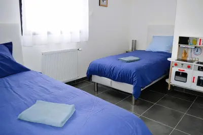 Un ou plusieurs lits dans un hébergement de l'établissement La Mer Veille, maison neuve avec jardin