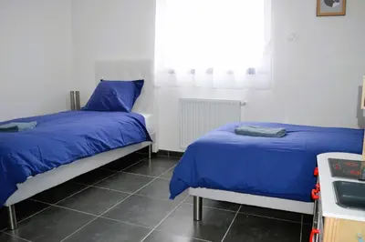 Un ou plusieurs lits dans un hébergement de l'établissement La Mer Veille, maison neuve avec jardin