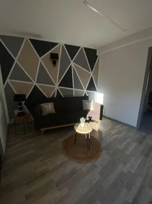 Coin salon dans l'établissement Gite comme chez soi Ducey les Chèris