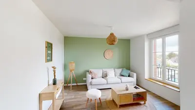 Coin salon dans l'établissement Appartement Les Sables d’Or