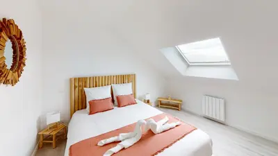Un ou plusieurs lits dans un hébergement de l'établissement Appartement Les Sables d’Or