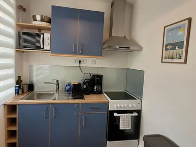 Cuisine ou kitchenette dans l'établissement Le Cocon - Barneville plage