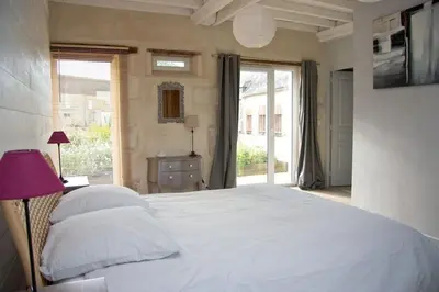 Un ou plusieurs lits dans un hébergement de l'établissement Maison Bel'Air Bayeux