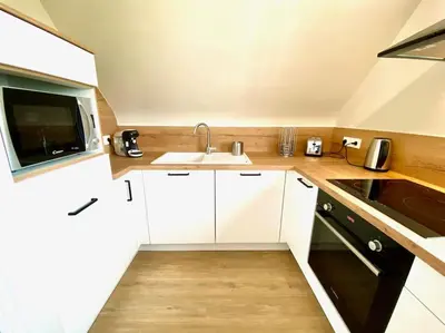 Cuisine ou kitchenette dans l'établissement Amateru - SILS