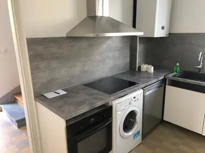 Cuisine ou kitchenette dans l'établissement FENUA : gite 5 chambres 10 couchages en ville