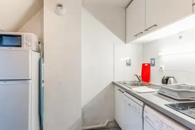 Cuisine ou kitchenette dans l'établissement Appartement Cassulo - Welkeys