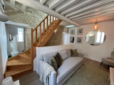 Coin salon dans l'établissement Bella, Joli appt rénové dans le bourg