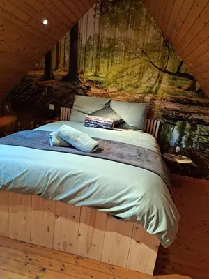 Un ou plusieurs lits dans un hébergement de l'établissement Cottage Le Cabanon