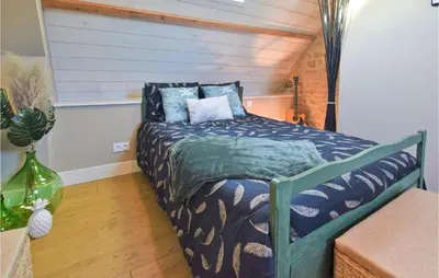 Un ou plusieurs lits dans un hébergement de l'établissement Cozy Home In Saint-Brice-De-Landell