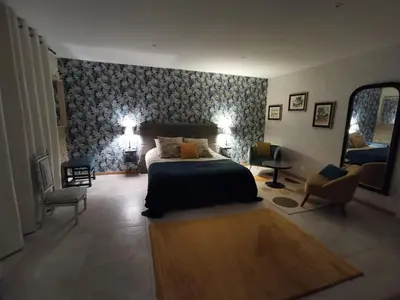 Un ou plusieurs lits dans un hébergement de l'établissement Chambre de l'Iris