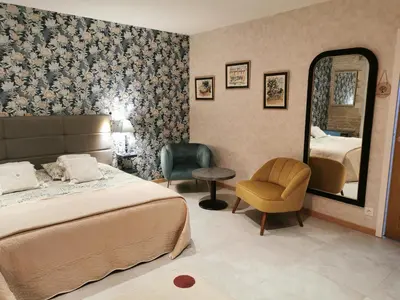 Un ou plusieurs lits dans un hébergement de l'établissement Chambre de l'Iris