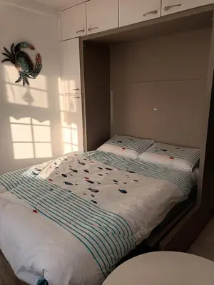 Un ou plusieurs lits dans un hébergement de l'établissement LE PETIT CABOURG de LA COUR NORMANDE studio coeur de ville -1 à 2 personnes