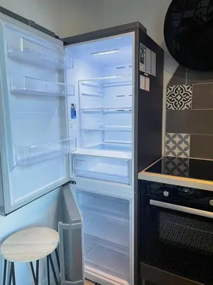 Cuisine ou kitchenette dans l'établissement Le Trois Fleurs