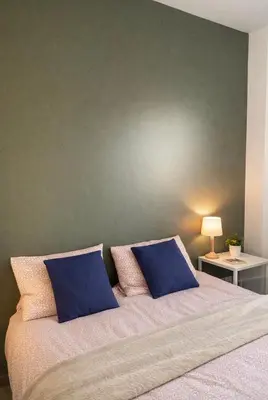Un ou plusieurs lits dans un hébergement de l'établissement Belle maison neuve à 5 mn de la plage