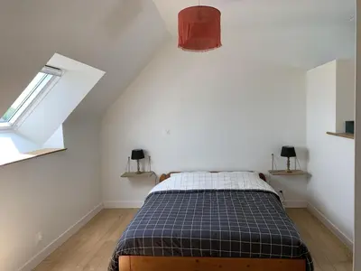 Un ou plusieurs lits dans un hébergement de l'établissement Charmante Maison de Campagne en Pierres et Bois