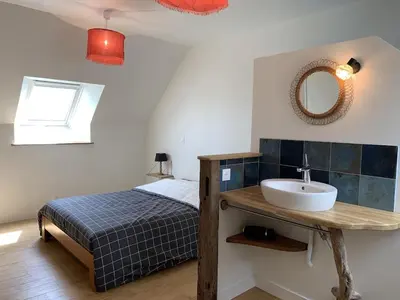 Un ou plusieurs lits dans un hébergement de l'établissement Charmante Maison de Campagne en Pierres et Bois