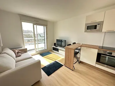Cuisine ou kitchenette dans l'établissement Appartement Caen
