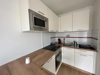 Cuisine ou kitchenette dans l'établissement Appartement Caen