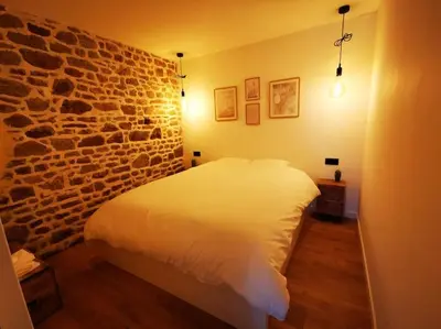 Un ou plusieurs lits dans un hébergement de l'établissement Gîte avec Spa
