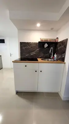 Cuisine ou kitchenette dans l'établissement Appart 2 chambres avec extérieur