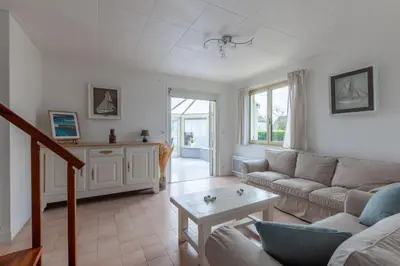 Coin salon dans l'établissement La maison des dunes - Proche plage pour 6