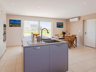 Cuisine ou kitchenette dans l'établissement Holiday Home Paradis des Dunes by Interhome