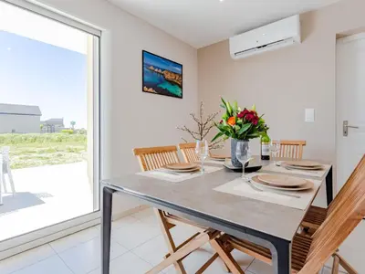 Télévision ou salle de divertissement dans l'établissement Holiday Home Paradis des Dunes by Interhome