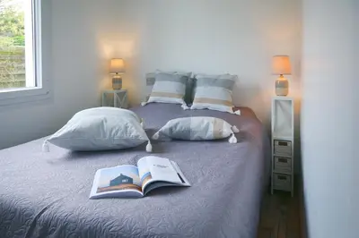 Un ou plusieurs lits dans un hébergement de l'établissement Maison Roudoudou - Charmante maison à moins de 300m de la plage
